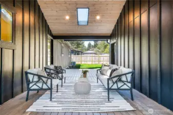 Welcome to your own slice of paradise, featuring a charming breezeway that connects the kitchen to a spacious bonus room