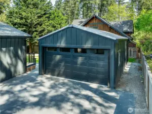 Spacious detached garage offers ample room for parking, storage, or a workshop