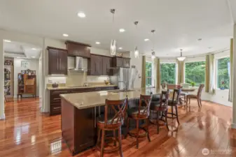 View of the kitchen breakfast table into dining room from the great room.