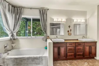 Primary bathroom with beautiful views of the outside as you relax