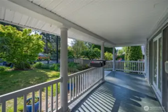 7333 39th Ave SW gracious wraparound front porch with glider swing