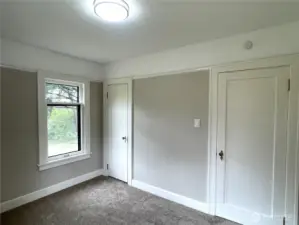 Bedroom number three, with the entry door on the right and the cedar lined closet on the left.