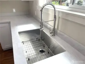 I love this stainless steel undermount sink, with the drying rack accessory. Wash, rinse and dry all in one place.