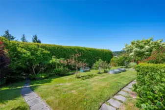 If you love to garden, you will enjoy this yard including mature landscaping, fruit trees & blueberry bushes.