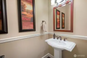 First floor powder room conveniently located close to garage too.