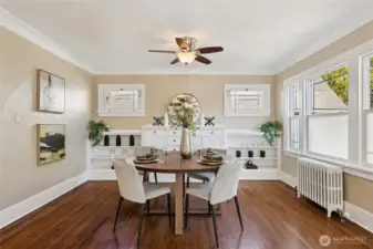 Dining area with built-ins off the living room area.  Natural light floods this space!