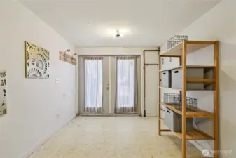 Former garage space used for storage.  Can be turned back into a garage if desired.