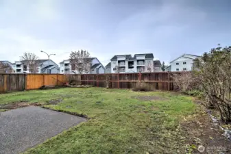 Fenced back yard with patio