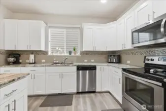 Cabinets and counter space for multiple cooks in this spacious kitchen