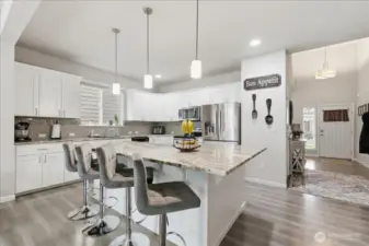 Seating at the bar, to watch the chefs at work.