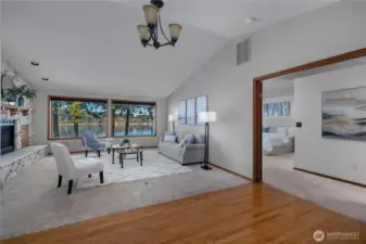 Seamless flow from living area to the main-level primary suite, all with water views nearby.