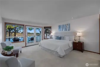 Wake up to tranquil waterfront scenery from this generous primary retreat.
