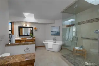 Spacious primary bath creates a peaceful extension of the suite.