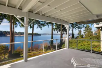 Lower Deck off FR offers a covered outdoor living area extends the home’s year-round enjoyment of the view.
