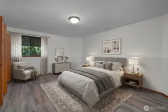 BR 4 - Oversized lower-level bedroom with room to relax and unwind.