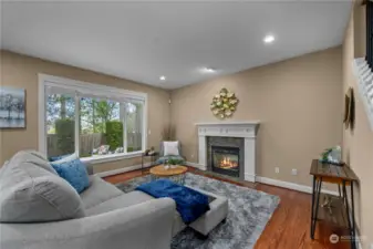 Unwind in the cozy family room featuring a fireplace, ideal for creating warm and inviting spaces.