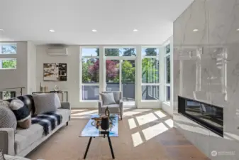 You have a private deck off of the front room nice for coffee/wine. Enjoy the fully tiled gas fireplace, tons up updates in this home you normally do not see in new construction