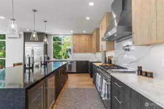 This is truly a Chefs kitchen, Quartz water fall center island, full quartz back splat, high end SS appliances, Wine fridge and a beverage fridge along with the main fridge