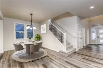 Formal dining room, virtually staged.