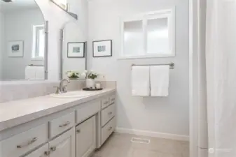 Full bath downstairs, there is another full bath upstairs and 1/2 bath in the mudroom area downstairs