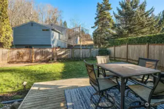 Sunny, Fenced Backyard With Large Deck, Brick Patio, Garden Space and Grassy Play Area