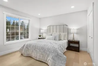 Main floor bedroom with hardwood floors (Bed #1)