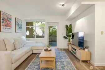 The open layout flows seamlessly to a spacious, landscaped patio.