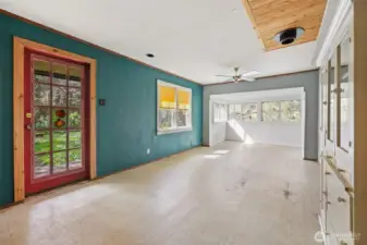 Living room, dining room, tv room ~ whatever you want, this house lives large for its square footage.