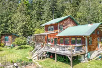 There is a large lovely deck overlooking the garden and the various flowering trees and shrubs.