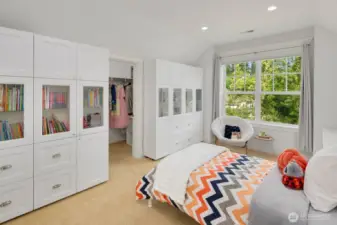 Large bedroom with built-ins and walk in closet