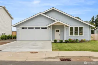 This brand new home has amazing curb appeal and is situated in such a lovely development along the shores of Drayton Harbor.