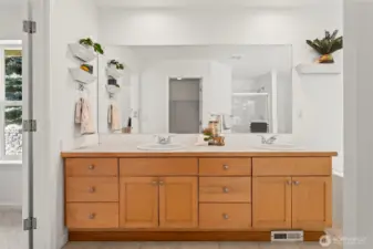Double vanities in this light and bright primary bath