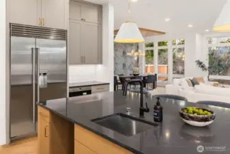 Intricate and delicate natural stone details highlight designer selected slab island