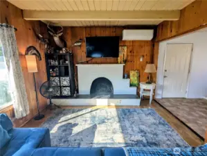 Wood burning fireplace, Mini split HVAC and open to kitchen