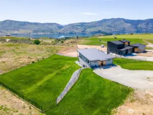 Partially fenced yard with sprinkler system!