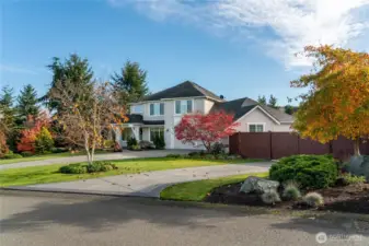 Corner lot on over an acre. Tons of mature landscaping. Fenced, small shop.