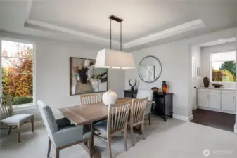 Formal dining room that has lots of natural light & attached butler's pantry. New carpet & paint!