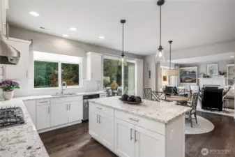 The kitchen is open to the family room and has a slider out to the oversized patio for grilling or relaxing.