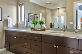 Primary bath with dual vanity.