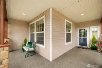 Covered and cozy, this porch invites year-round enjoyment with space to relax, unwind, and greet guests in style.