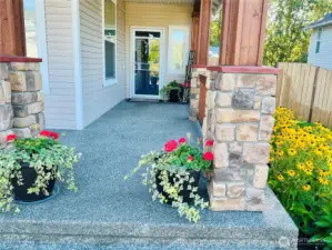 Warm stone accents and welcoming entry details create an elegant first impression before you even step inside.