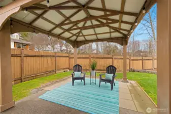 A charming backyard gazebo creates an outdoor living room—ideal for summer dinners, birthday celebrations, or shaded afternoon lounging.