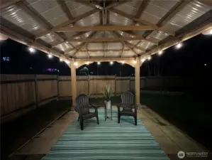 As the sun sets, the gazebo transforms into a magical retreat for twinkle-lit gatherings and quiet evenings under the stars.