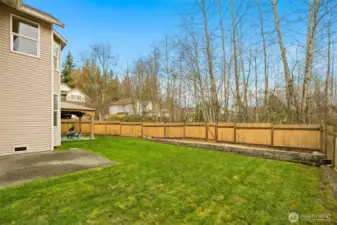 Fully fenced and expansive, the backyard opens to tranquil greenery, offering rare privacy and room to play, garden, or simply relax.