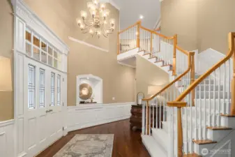 Enter to a grand, light-filled foyer that reveals a signature statement in craftsmanship of this lauded, premier Northwest Builder ~ beautifully detailed crown moldings, coffered ceilings, chair rail, wrapped windows, extensive built-ins and quality trim finishes providing warmth and sophistication.