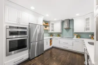 Tiled kitchen and stainless steel appliances give a luxury look.
