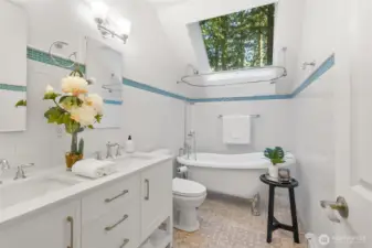 Upstairs bathroom with a large skylight. Look at the trees.