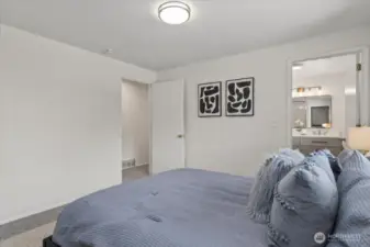 Primary bedroom with ensuite bathroom has been completely remodeled.