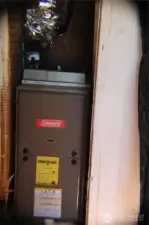 Natural gas furnace, tucked in a closet under the stairs