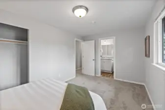 Primary bedroom looking to the adjoining continental/full bathroom.